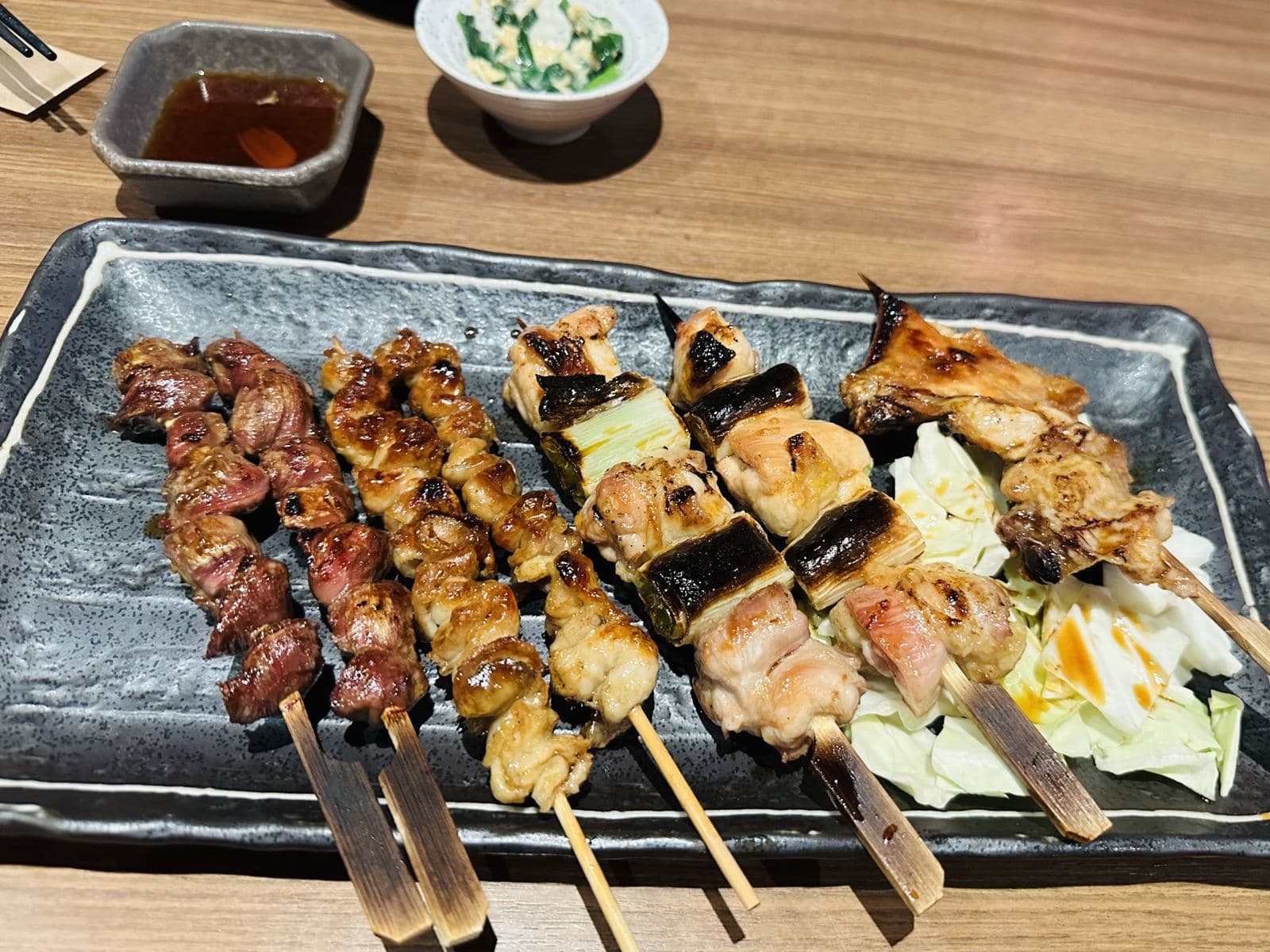 Grilled moo ping pork skewers