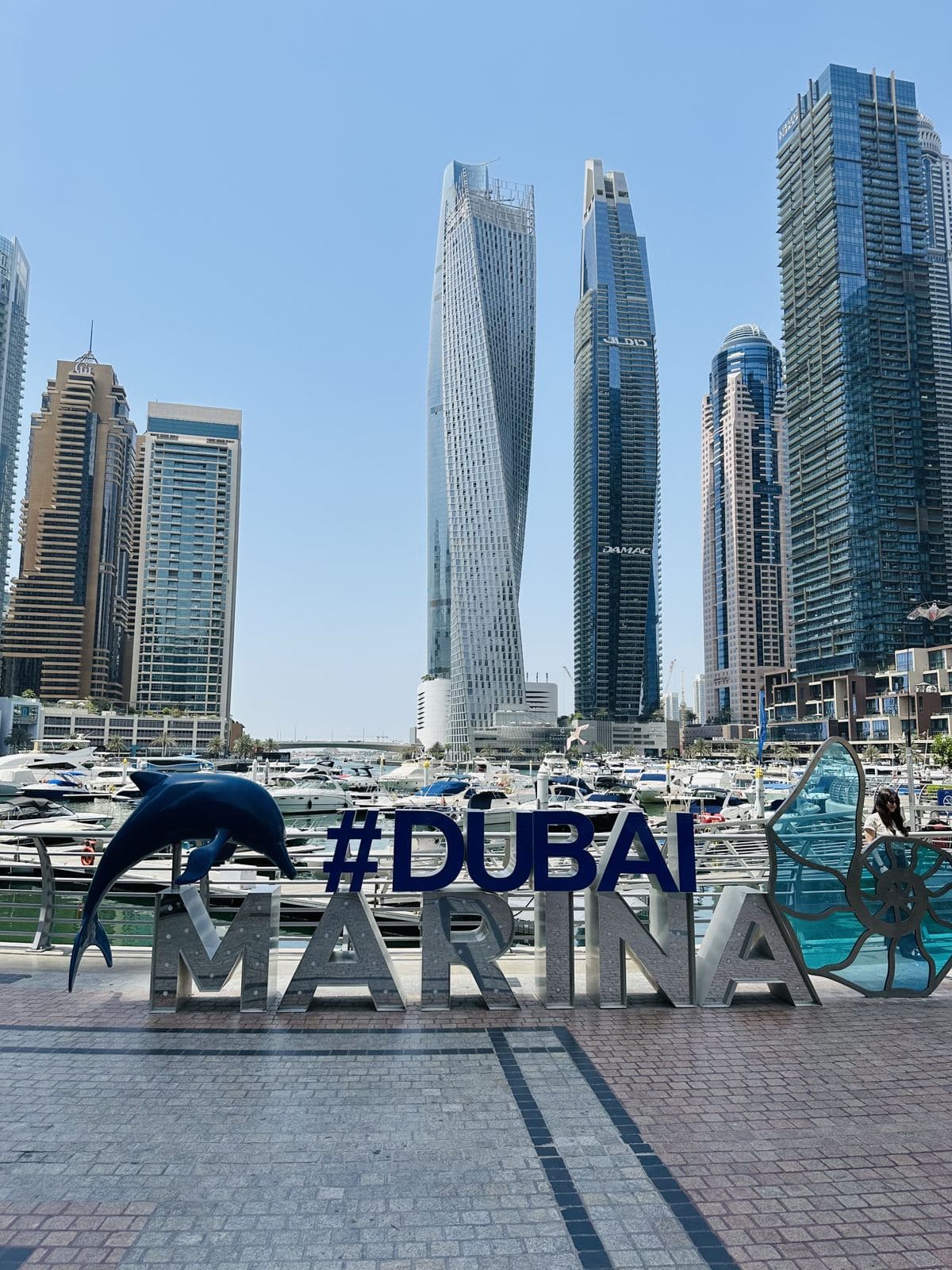 The #DubaiMarina sign on the marina walk