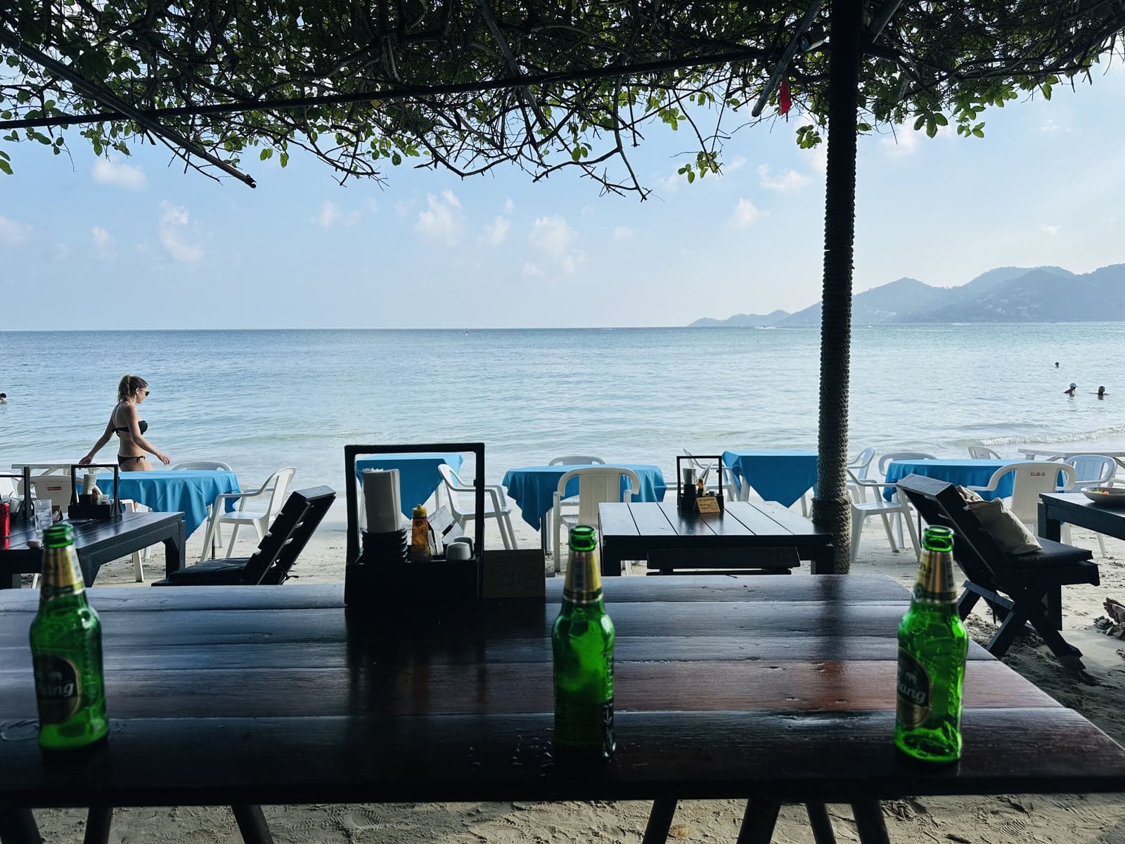 Beachfront restaurant tables with cold Chang beers